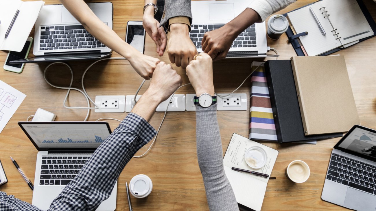 Colleagues giving a fist bump