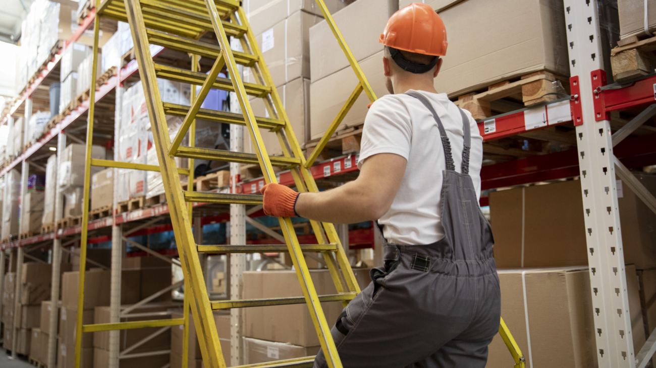 medium-shot-man-working-at-warehouse